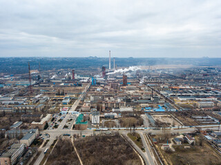 Aerial view from drone of industrial zone with fuming chimneys. Chemical plant