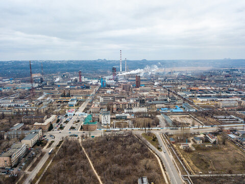 Aerial view from drone of industrial zone with fuming chimneys. Chemical plant