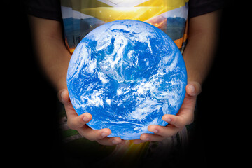 World in hand young generation. Blue planet on hand. save of earth. The concept of young children taking care of the world .Elements of this image furnished by NASA