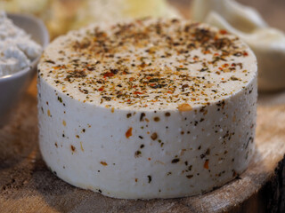 Rustic homemade cheese with spices. Natural eco-friendly product