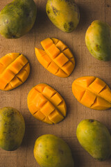Alphonso mango slices on wooden background stock image with selective focus.
