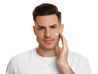 Handsome man applying face cream on white background