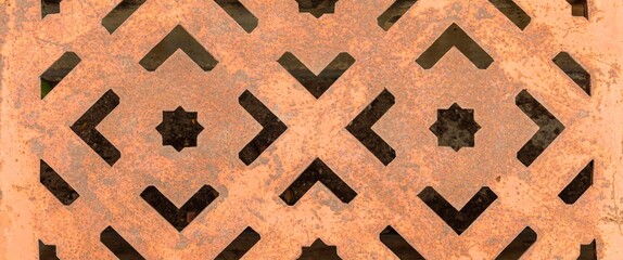 Panorama of The steel manhole cover has a stencil to rust texture and background