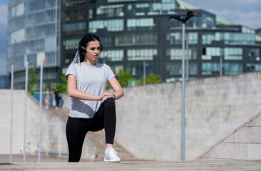 Fitness sport woman with african braids doing stretching exercise in the park