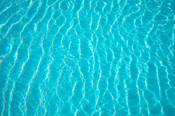 Clear water in outdoor swimming pool on sunny day