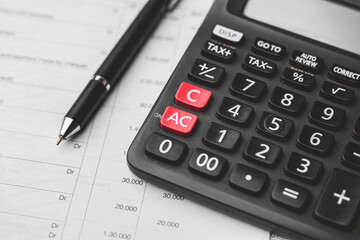 Black calculator on texture background stock image.