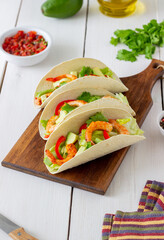 Tacos with shrimp, avocado and salad. Mexican food.