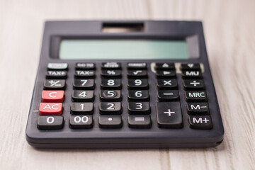 Black calculator on texture background stock image.