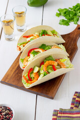 Tacos with shrimp, avocado and salad. Mexican food.