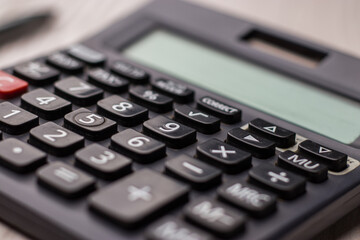 Black calculator on texture background stock image.