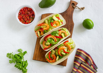 Tacos with shrimp, avocado and salad. Mexican food.
