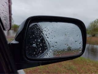 Rear view mirror with raindrops 