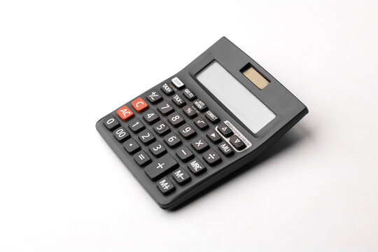 Black calculator on white background isolated stock image.