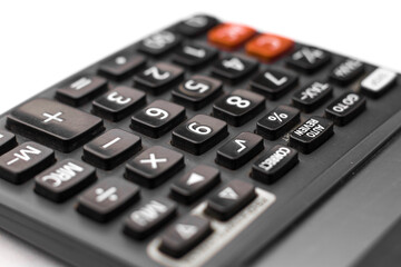 Black calculator on white background isolated stock image.