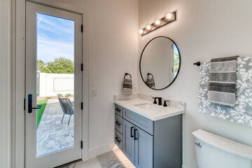 bathroom with a glass door to a patio