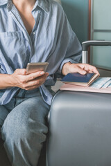 Travel. Online travel plans with Covid passport and Covid test. Traveling after quarantine, lockdown, covid 19. Staycation.local travel new normal.Girl packs baggage in  suitcase and travel documents