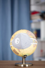 A globe with a mask
