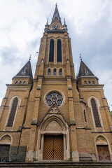 Fototapeta na wymiar Backa Topola, Serbia - June 06, 2021: Roman Catholic Church of the Immaculate Virgin Mary in Backa Topola. It has the tallest tower in Eastern Europe 72.7m