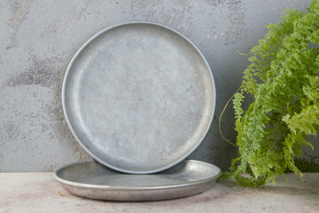Old metal plates for scales on concrete background.