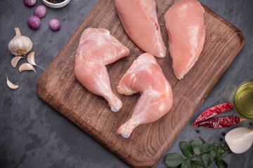Raw fresh  chicken drumsticks and breast