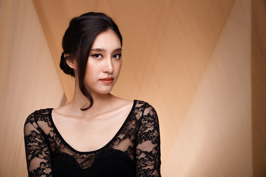 Asian Thai girl wear lace dress with beige blazer suit