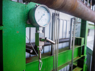Pressure gauge of measuring instrument close up in industry zone at power plant with closed up