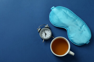 Different sleep routine accessories on blue background