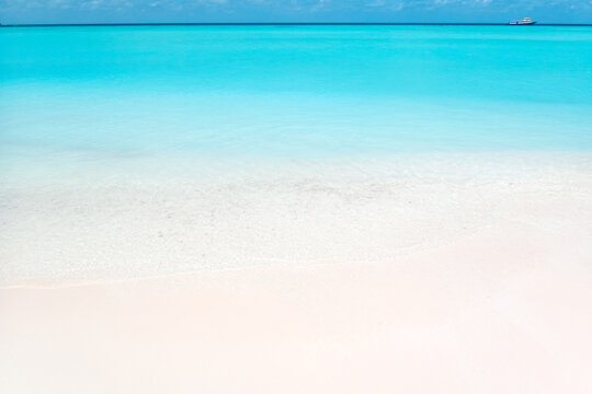 The beautiful gradient blue sea and white sandy beaches of the Maldives