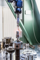 The coordinate measuring machine measures the part