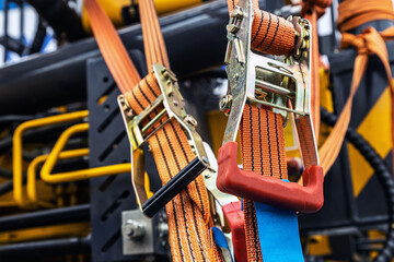 tension safety belts with mechanical locks. stretch textile slings hold - 438777298