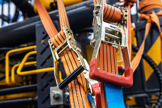 tension safety belts with mechanical locks. stretch textile slings hold