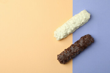 Tasty candy bars on two tone background