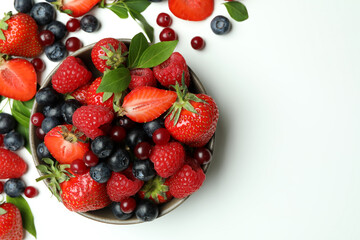 Fototapeta na wymiar Delicious fresh berry mix on white background