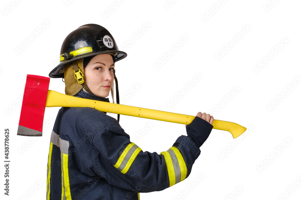 Wall mural young brave woman in uniform and hardhat of firefighter with axe on shoulders and looking at camera 