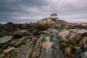 Senhor da Pedra church in Miramar, Portugal, during overcast weather