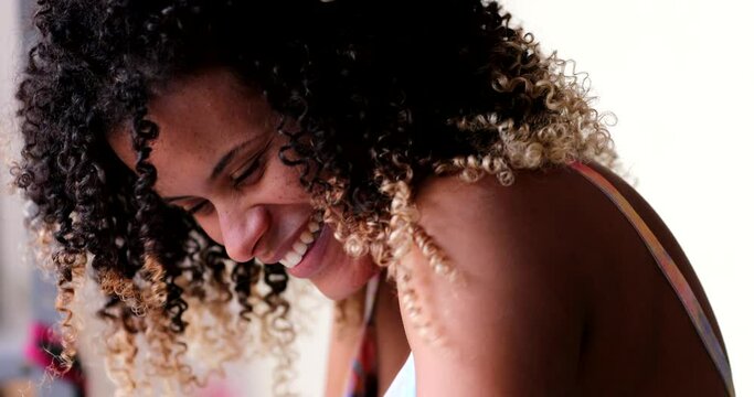 Hispanic black woman portrait smile close-up face, real life laugh and smile