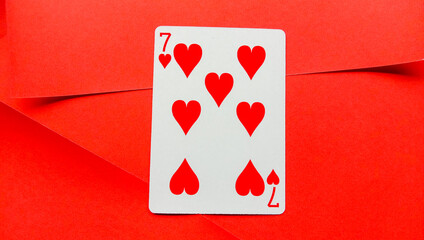 Playing cards are red on a red background