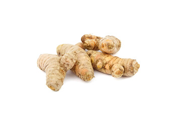 Turmeric spice rhizome isolated on white background. Heap of curcuma longa roots