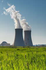 Green grass against nuclear power plant