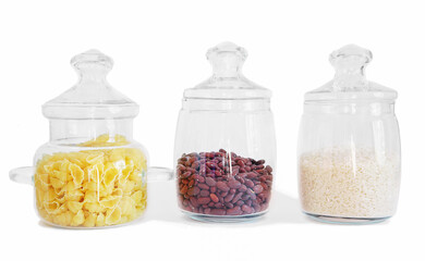 glass jars for food storage. pasta, rice and beans in transparent containers. isolated. home order and household.