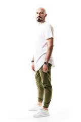 Fototapeta premium Casual modern trendy bald bearded hipster posing with arms down. Full body length isolated on white background