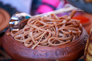 
Cooked, appetizing noodles in a clay bowl․ 
Vermicelli in plate.
