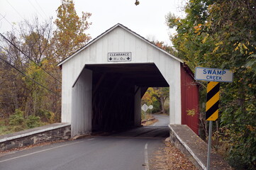 Erwinna White and Red Wooden Covered Bridge in Early Fall Daylight