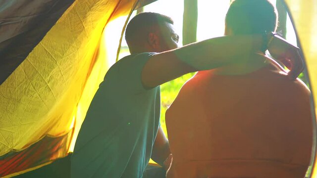 african people on camping trip welcoming a new day in summer park