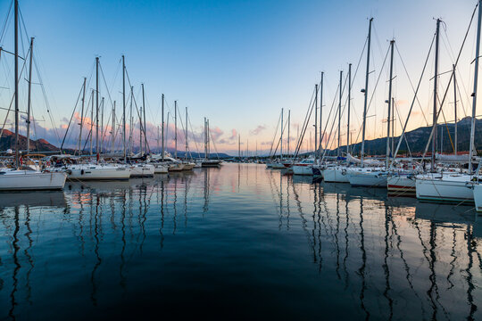 Marina yacht club on the European island of Sardinia at sunset