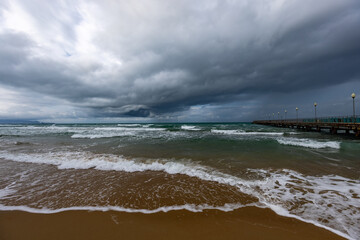 Beach by the sea in stormy cloudy weather