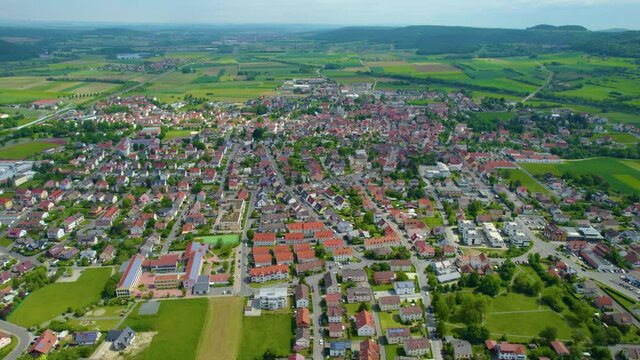 Aerial view of the city Bad Staffelstein in Germany, on a cloudy day in spring.
