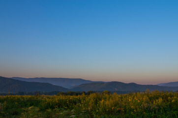 Mountain panoramic landscape with clouds and blue sky
