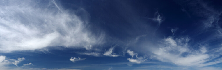 Obraz premium High resolution sky panorama with cirrus clouds. White clouds in deep blue sky.
