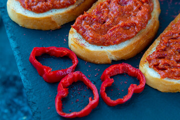 Homemade bruschetta with red pesto sauce